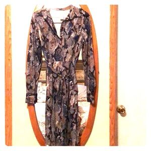 Adorable, small, long sleeve polyester dress.